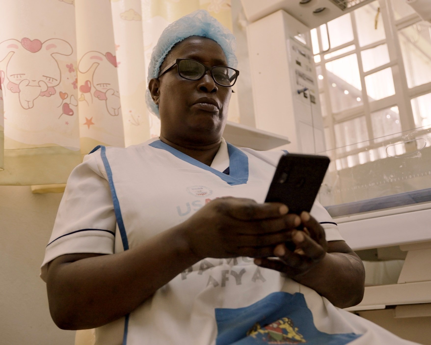 Alice Muhonja, Head Nurse at Mutuini Health Center accesses remote EmONC learning at her fingertips through Jacaranda's mHealth learning platform DELTA.