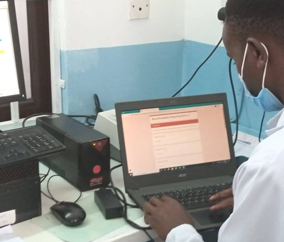 Lab facility staff filling in the Google Form with blood supply updates.